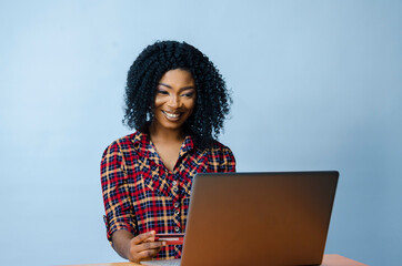 Wall Mural - beautiful african business woman isolated over whit background feeling excited