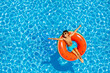 Boy swim on inflatable ring view from above