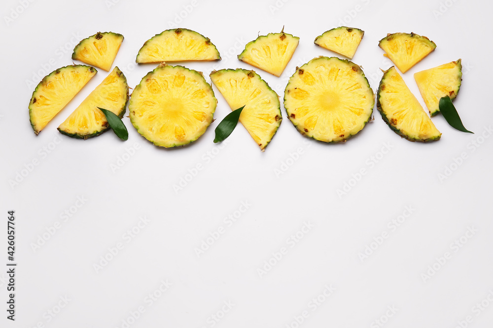 Slices of fresh pineapple on white background