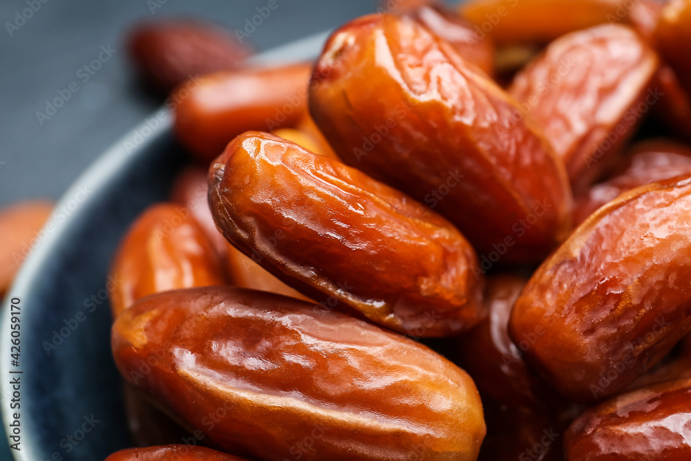 Bowl with sweet dried dates, closeup