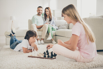 Sticker - Photo portrait of friendly family spending time together little children daughter son playing chess near parents