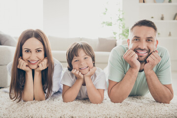 Sticker - Photo of optimistic nice family mom dad kid hands face lie on floor wear t-shirts at home