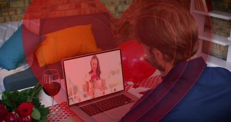 Poster - Concentric red hearts forming over caucasian man waving while having a video call on laptop