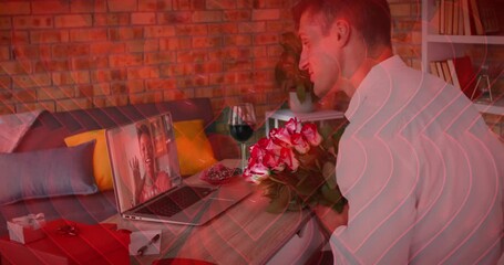 Poster - Red heart icons over caucasian man holding a flower bouquet while having a video call on laptop