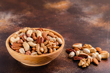 Wall Mural - Various Nuts in wooden bowl.