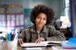 © Tetra Images - African American boy studying in classroom