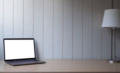 Cropped shot of minimal workspace with mock-up laptop, decorations and copy space.