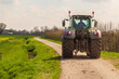 © Jan van der Wolf - A tractor in the countryside in the spring in the Betuwe.