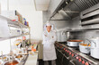 © Tetra Images - Hispanic cook in commercial kitchen