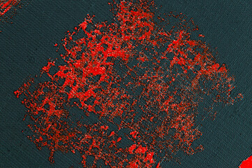 abstract creative background: red spots, strokes and splashes of colored primer when toning a black canvas, a temporary object.