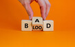 © Dzmitry - Breed bad blood symbol. Businessman turns cubes and changes the word 'bad' to 'blood'. Beautiful orange background, copy space. Business, breed bad blood concept.