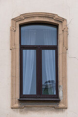 Windows on old city facades, with decorative elements