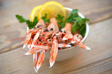 Sticker - boiled crayfish, with oil and lemon sauce, on a plate, karavides in Greek