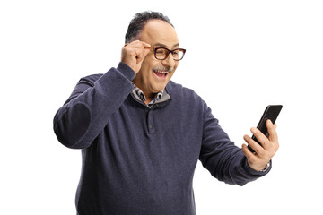 Poster - Excited mature man with glasses looking at a smartphone