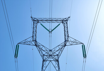 High voltage electrical power distribution turret over clear sky