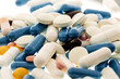 Close up of random pills capsules. Medicine and pharmacy concept.