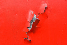 Red Metal Texture With Parts Of Paint Peeling Off.