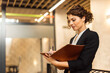 © bnenin - Portrait of a manager signing the document.