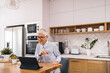 © bnenin - Hard working woman, at home, sitting at kitchen.