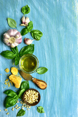 Wall Mural - Food background with fresh ingredients for making basil pesto .