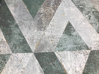 Poster - gray texture. ornament on the tiles. pattern and stains on the tiles in the bathroom and toilet. tiles in strict concrete shades. geometric pattern on tiles in shades of green and gray