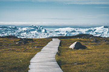 view towards icefjord in ilulissat. easy hiking route to the famous kangia glacier near ilulissat in