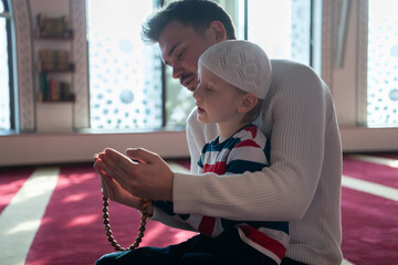 Wall Mural - muslim prayer father and son in mosque prayingtogether