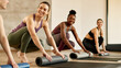 © Drazen - Group of happy athletic women talking while preparing for sports training at health club.