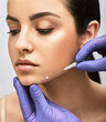 © Peakstock - Mesothreads facial. Face contour lifting procedure, a needle with mesothreads near a female face, close-up
