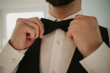 Sticker - Bearded groom fixing his bow tie and getting prepared for his wedding