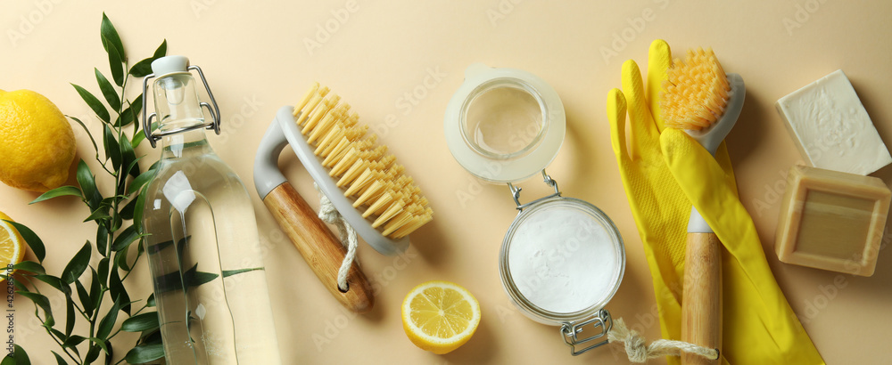 Cleaning concept with eco friendly cleaning tools and lemons on beige background - obrazy, fototapety, plakaty 