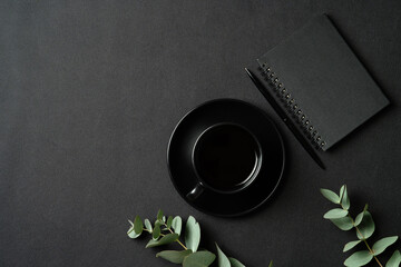 Fototapete - Luxury style office desk table with cup of coffee, paper notebook, pen, eucalyptus branch on leather background. Flat lay, top view, copy space.