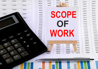 Poster - Scope of work on small easel with charts, pen and calculator.Business concept.