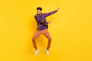 Poster - Full size portrait of cheerful dark skin person enjoy dancing have good mood isolated on yellow color background