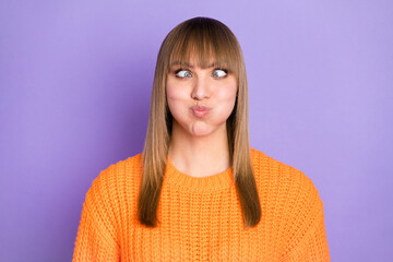 Poster - Photo of foolish lady crossed eyes puffed blow cheeks wear orange pullover isolated violet color background