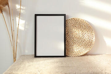 Black photo frame mockup with dry cane