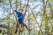© galitskaya - Happy child in a helmet, healthy teenager school boy enjoying activity in a climbing adventure park on a summer day