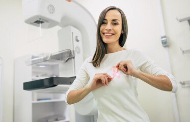 Wall Mural - Young woman is having mammography examination at the hospital or private clinic with a professional female doctor.