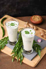 Wall Mural - Spiced buttermilk , chaas , chaach , moru , sambharam , curd, lassi , yogurt, cool refreshing drink for hot summer in glass , Kerala, India. Flavored Indian buttermilk.