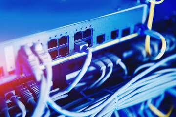 fiber ethernet cable on network switches optical connector interface. concept internet data center b