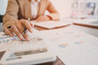 © mojo_cp - Man Analysis Business Accounting working with Individual income tax return.Accounting concept.