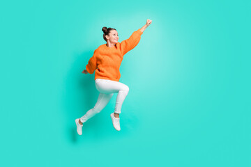 Full size profile photo of optimistic nice brunet lady jump wear sweater jeans isolated on teal background