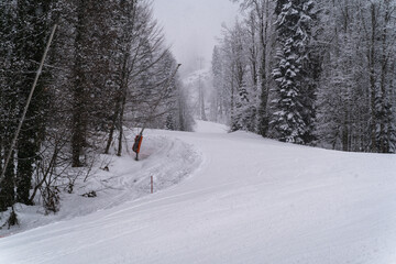 Wall Mural - Snowfall and fog Bad weather in ski slopes of ski resort Krasnaya Polyana , Sochi, Russia.