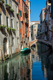 Fototapeta  - discovery of the city of Venice and its small canals and romantic alleys