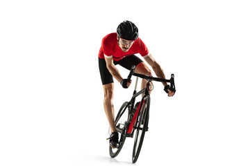 Wall Mural - Professional male bike rider on road bike isolated over white background.