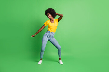 Canvas Print - Full length body size photo of dancing overjoyed girl spending free time relaxing isolated on bright green color background