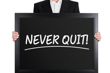 Wall Mural - Businessman holds a big signboard with never quit message on isolated white background.