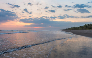 Wall Mural - Beautiful sunset sky on the beach in Matapalo, Costa Rica. Central America. Sky background on sunset. Tropical sea.