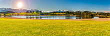 Beautiful Rural Landscape In Bavaria With Mountain Range And Meadow At Springtime