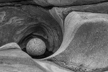 Protected Stone Ball In Natural Glacial Mill With Beautiful Textures In Old Granite Stone. Harmony, Balance And As A Sign Of Infinity And Eternity. Spa And Wellness Concept. Black And White.